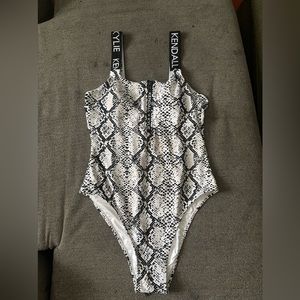 Kendall and Kylie, black and white one piece bathing suit